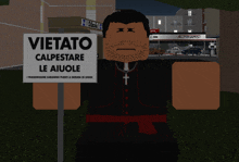 a man holding a sign that says vietato calpestare le aiuole