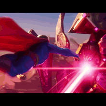 superman is flying in the air with a red cape