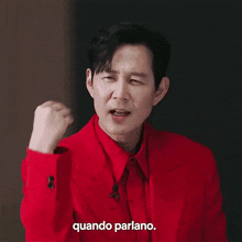 a man in a red suit says quando parlano in a foreign language