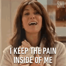 I Keep The Pain Inside Of Me Kristen Wiig GIF - I Keep The Pain Inside Of Me Kristen Wiig Saturday Night Live GIFs