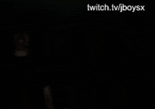 a person is standing in the dark with twitch.tv/jboysx written on the bottom of the screen