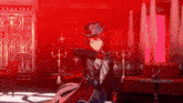 a man in a top hat is dancing in a room with red lights