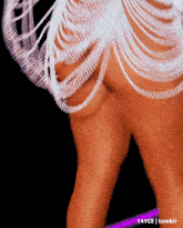 a close up of a woman 's butt in a white dress with rhinestones .