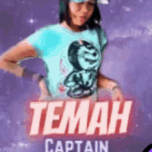 a girl in a blue shirt is standing in front of a sign that says captain