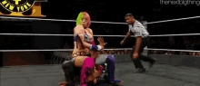 two women are wrestling in a ring while a referee looks on .
