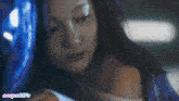 a close up of a woman 's face with the word vespa gifs on the bottom right