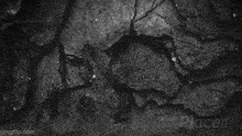 a black and white photo of a hole in a wall made with placeit