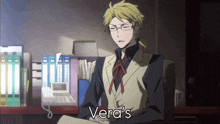 a man sitting at a desk with vera 's written in the corner