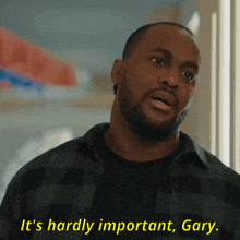 a man wearing a plaid shirt says it 's hardly important gary