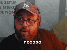 a man wearing glasses and a hat says " nooooo " in front of a sign that says " el setup "