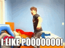 a man is jumping on a bed with the words `` i like p000000 '' written on the bottom of the image .