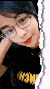 a woman wearing glasses and a black shirt that says " wow "