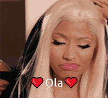 a close up of a woman 's face with a heart and the words ola on it