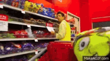 a man in a yellow vest is pushing a shopping cart in a grocery store