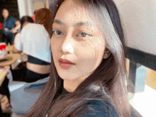 a close up of a woman 's face with her eyes closed