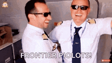 two pilots are hugging each other and one of them says frontier pilots .