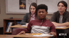 a man sits at a desk with a netflix logo on the bottom