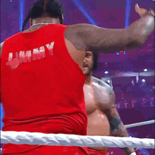 a man in a red tank top that says rammy on it