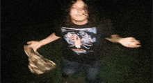 a blurry picture of a person wearing a t-shirt with a picture of a spider on it