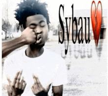 a man with his eyes closed is being punched in the face by someone with sybau written on the bottom