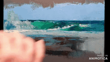 a person is painting a picture of the ocean and the words made in animotica are on the bottom
