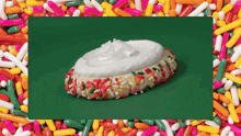 a cookie with whipped cream and sprinkles on top