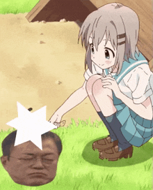 a girl in a school uniform is kneeling down next to a man 's head
