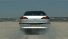 a blurry picture of a car driving down a street