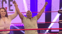 two women in a wrestling ring with the word imf on the side