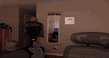 a man stands in front of a mirror in a room with a sign on the wall that says ' youtube '