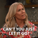 a woman says " can 't you just let it go " while wearing a striped shirt