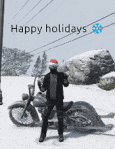 a man wearing a santa hat is standing next to a motorcycle in the snow