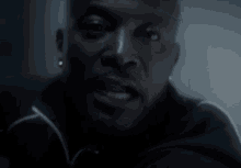 a close up of a man 's face with a blurred background