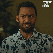 a man with a beard says just awful in a floral shirt