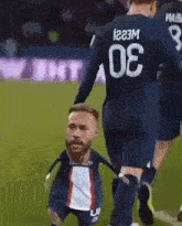 a soccer player with the number 80 on his back