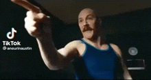 a man in a suit and tie is being punched in the face by another person .