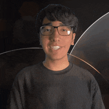 a young man wearing glasses and a black shirt with the word chase on it