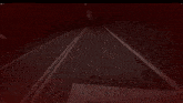 a computer screen with a red background and a shadow of a person on it