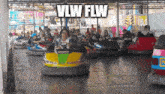 a group of people are riding bumper cars with the words vlw flw written above them