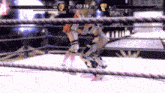 two women are wrestling in a ring and the time is 0:38