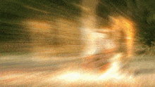 a blurred image of a person walking through a tunnel of light