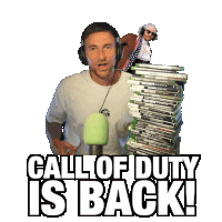a man giving a thumbs up next to a stack of call of duty video games