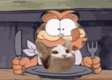 garfield is holding a knife and fork while a cat is sitting on a plate