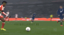 a soccer game is being played in a stadium with a banner that says " football jersey us "