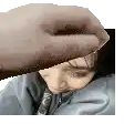 a hand is touching a woman 's forehead .