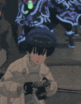a person holding a camera with the letter c on the back