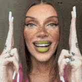 a woman with freckles is holding two toothbrushes over her head