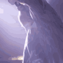 a man singing into a microphone with a shirt that says ' n ' on it