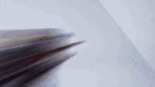 a blurred image of a person 's face against a white background