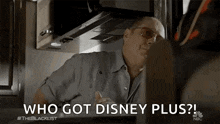 a man is talking to another man in a kitchen and says `` who got disney plus '' .